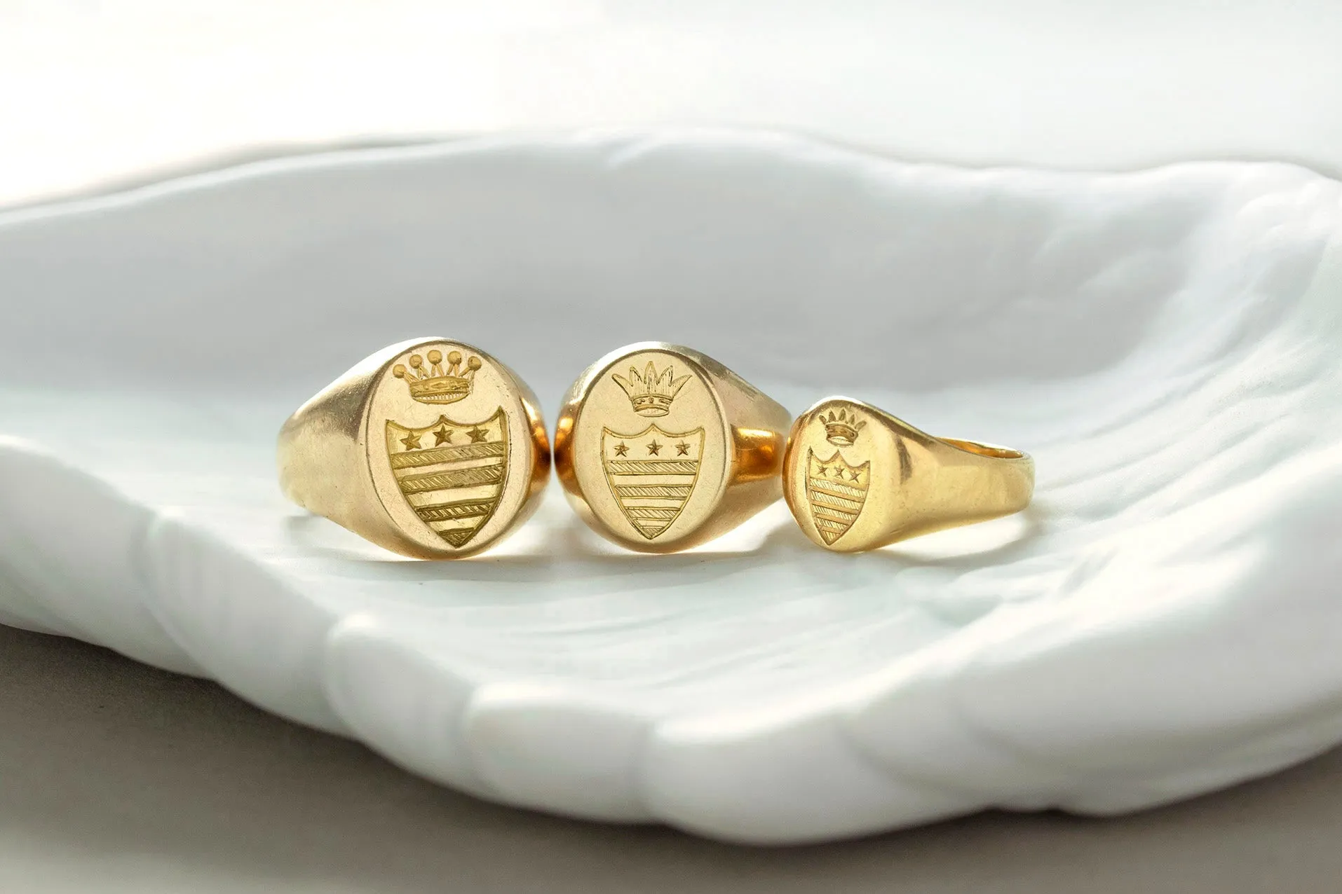 A Set of Three Gold Signet Rings for One Family