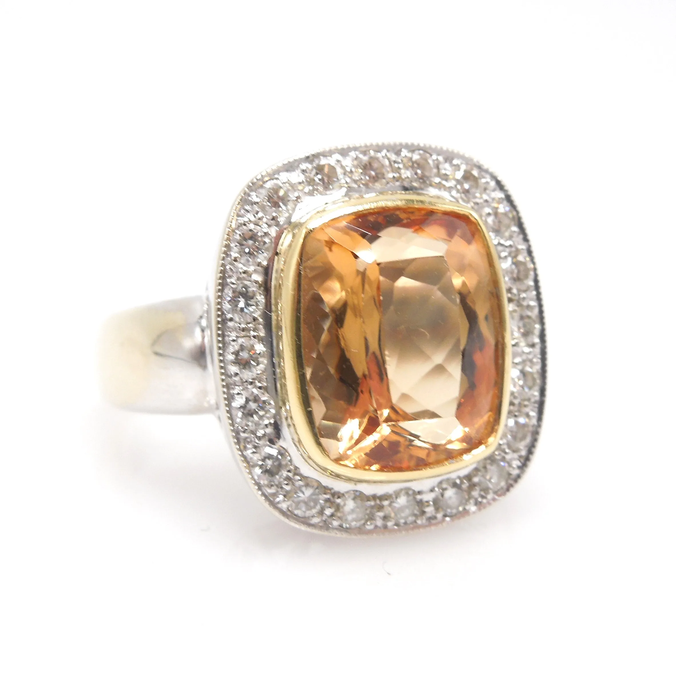 Approximately 6.00 Carat Precious Topaz Ring with Diamond Halo in 18K