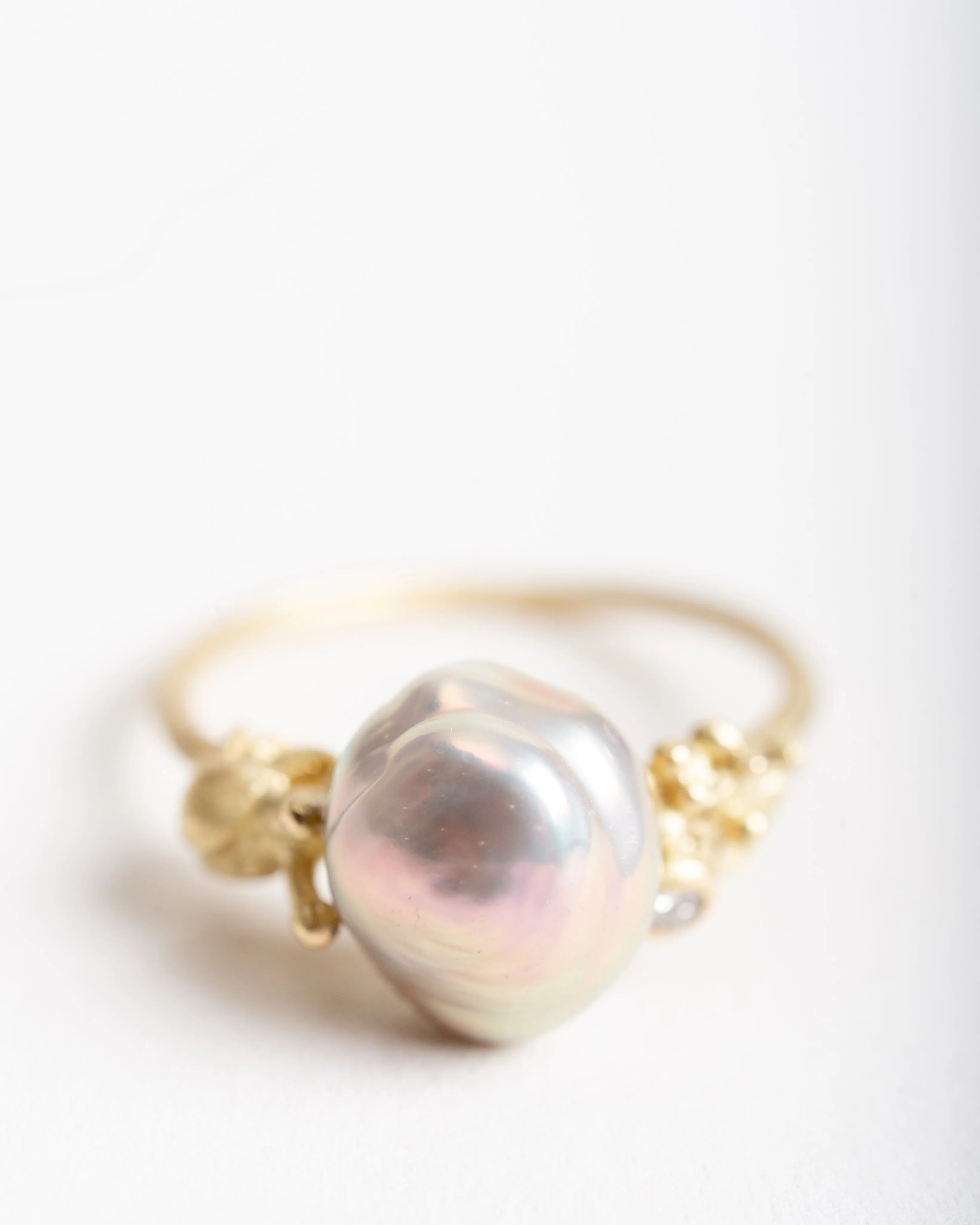 pearl ring with snail and diamond