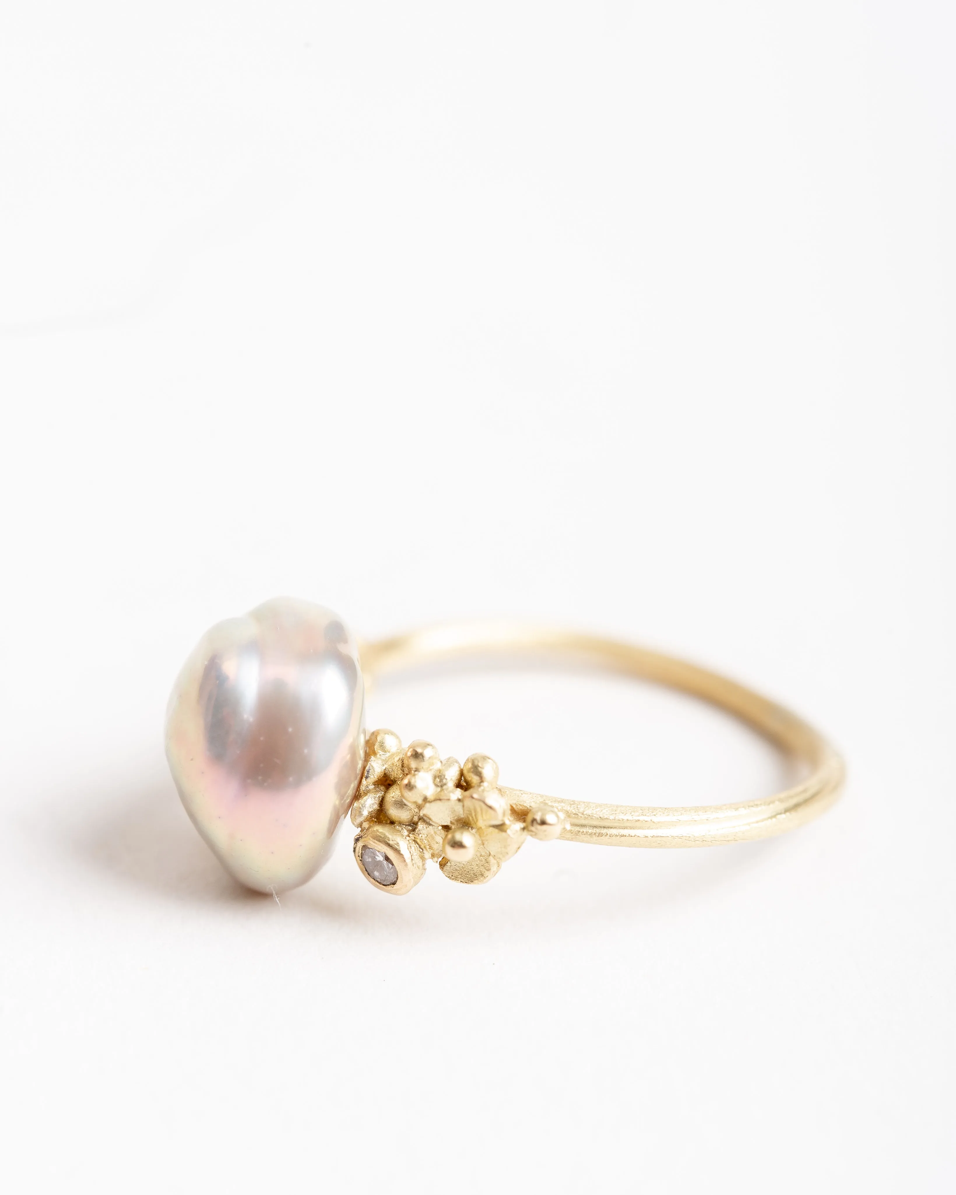 pearl ring with snail and diamond