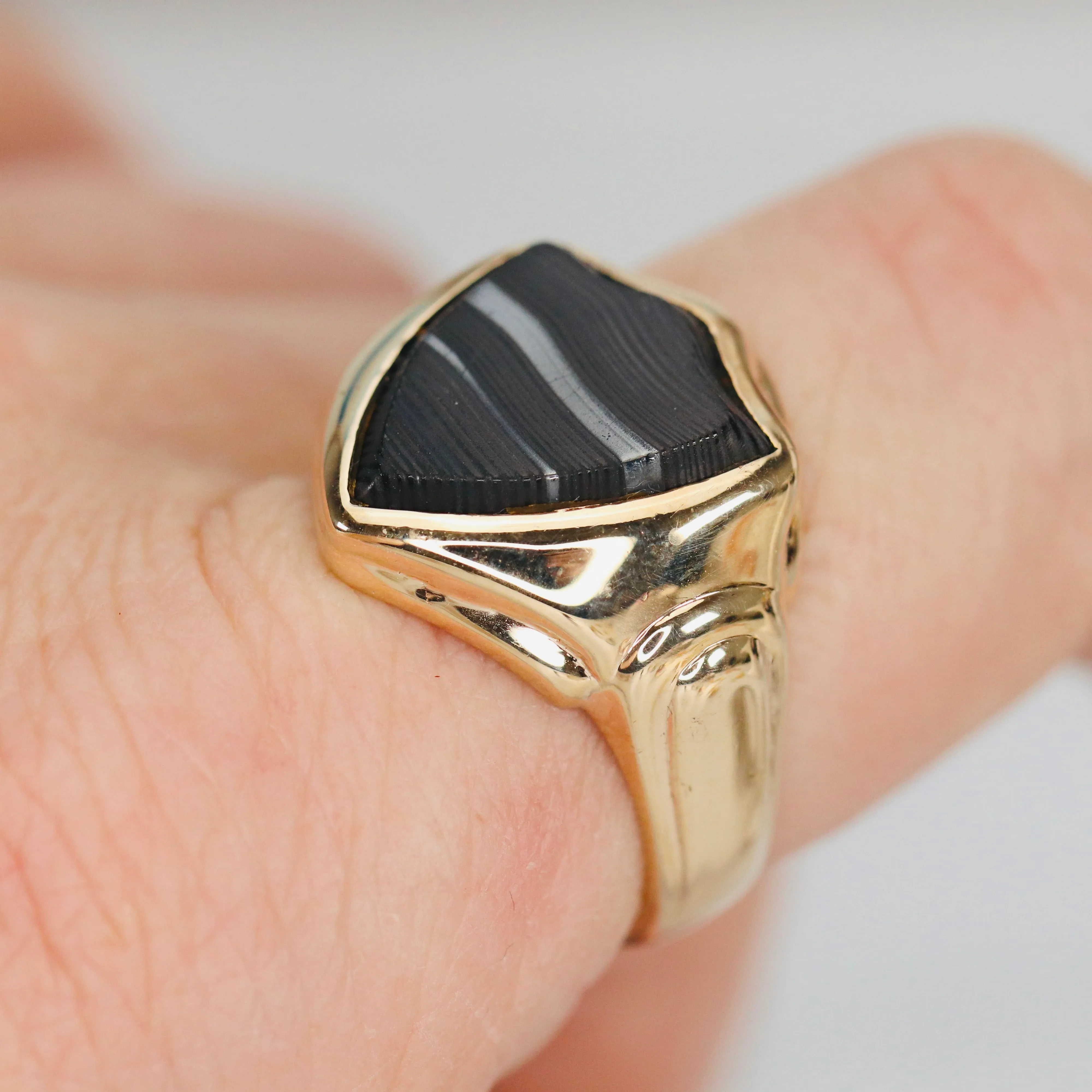 Vintage shield shaped banded agate (onyx family) ring in yellow gold